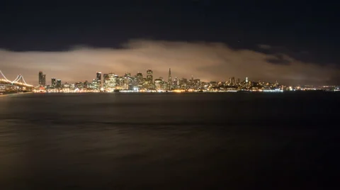 Time lapse of cloudy San Francisco shoreline and the bay bridge at night 2 Stock Footage 43369244