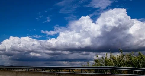 Time-lapse of cloudy sky next the highway in Italy, Tuscany. 4K Stock-Footage 73185668