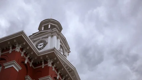 Time-lapse of cloudy sky over bell tower city hall Stock Footage 105976861