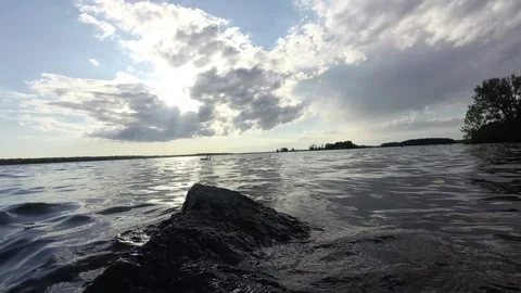 Time-lapse of a cloudy sky over a lake 스톡 동영상 207869643