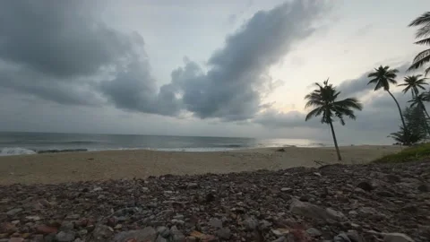TIME LAPSE OF CLOUDY SUNRISE ON THE BEACH 動画素材 234199275
