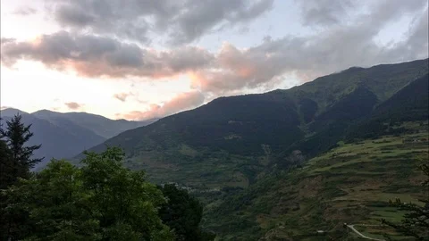 Time lapse of a cloudy sunset in the mountains Stock Footage 103787453