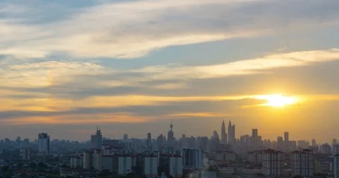 Time lapse of cloudy sunset over downtown Kuala Lumpur, Malaysia Stock Footage 77395334