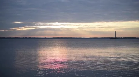 Time lapse of colorful clouds over water Stock Footage 68748417