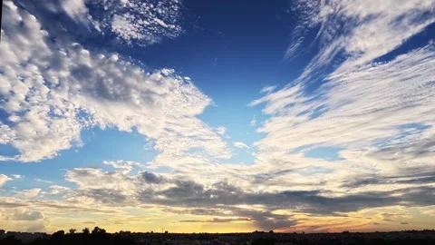 Time lapse colorful clouds over the city Stock Footage 303590275
