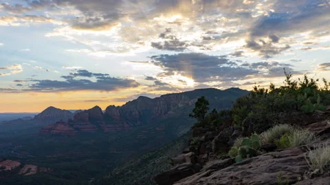Time lapse of a colorful sunset beyond desert sandstone rock formations Stock Footage 245461092