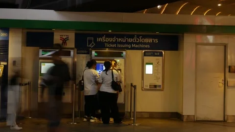 Time Lapse Commuters Buying Tickets at BTS Skytrain Ticket Stock Footage 339518188