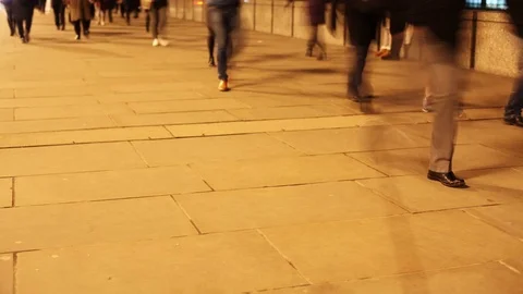 Time-lapse of commuters at night walking along a pavement Video stock 71181465