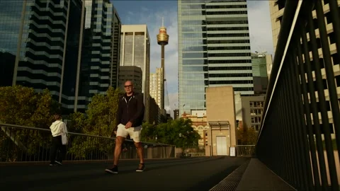 Time lapse commuters with Sydney Observation Tower and skyscrapers 4K Stock Footage 305606208