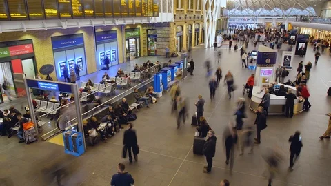 Time Lapse of commuters walking through Kings Cross Station Stock Footage 102844241