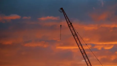 Time-lapse Construction Crane Silhouette Against Dramatic Sunset Clouds 库存影片 347500223