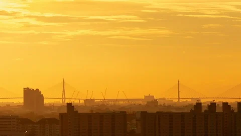 Time lapse construction crane working with suspension bridge on Sunset Video stock 95189002