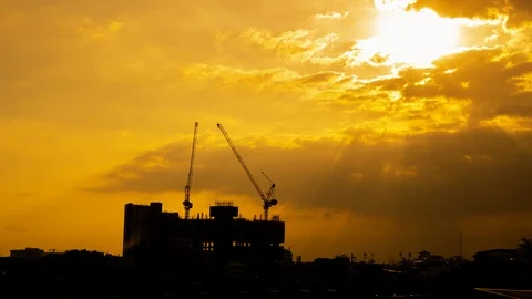 Time lapse, construction cranes are building in the evening with a dramatic sky Stock Footage 120366538