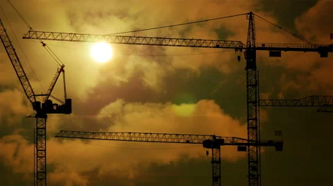 Time lapse of construction cranes silhouettes at sunset light. build develop Stockbeeldmateriaal 40653486