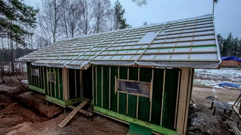 Time lapse construction of house from start to finish, season changing Stock Footage 260891249