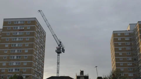 A time lapse of a construction lifting crane Stock Footage 256295376