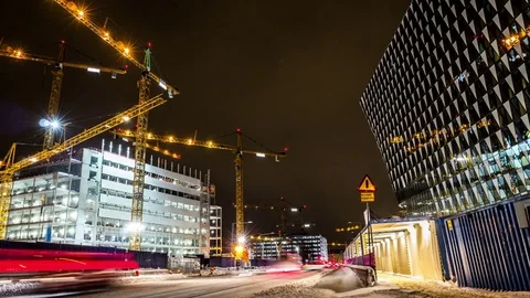 Time Lapse of construction site and reflective office building at night Stock Footage 71189208