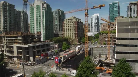 Time lapse of a construction site with road traffic next to it in Vancouver Stock Footage 159908907