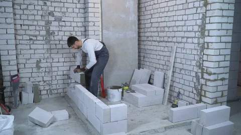 Time lapse of construction worker building interior wall Stock Footage 102555026