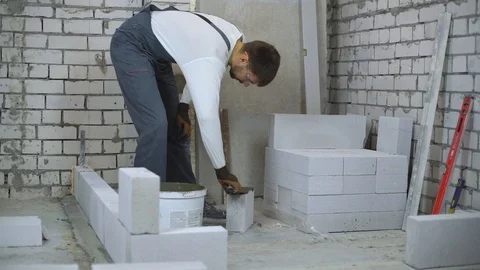 Time lapse of construction worker building interior wall Stock Footage 103943158