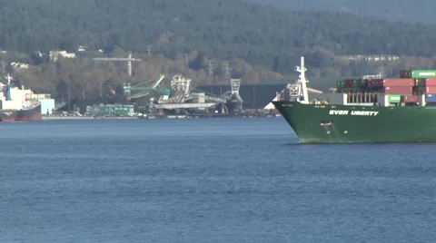 Time Lapse of container ship moving through static frame,  vancouver harbour Stock Footage 53051902