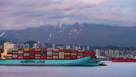 Time lapse of container ship passing city Stock Footage 149380202