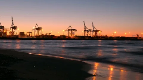 Time Lapse Container Ship Terminal and Cranes in the Evening Stock Footage 94650138