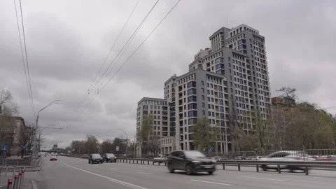 Time-lapse of a contemporary home under rapidly moving gray clouds Stock Footage 332572346