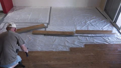 Time lapse of a contractor laying a laminated floor Stock Footage 109358928