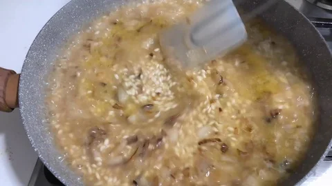 Time lapse of cooking risotto, a typical Italian recipe with rice. Stock-Footage 85718144