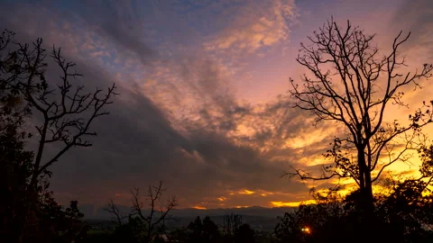 Time lapse couds moving in the sky from sunset to night over the town Stock Footage 261977044
