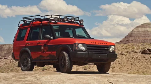 Time Lapse of Coulds with Land Rover Adventure Moab in Wild Landscape Parked Stock Footage 41505041