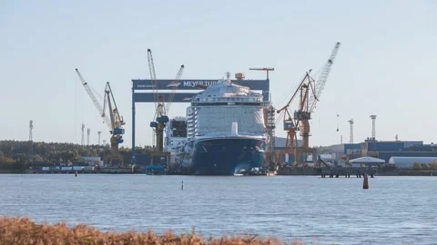 Time-lapse of cranes and workers building the cruise ship Mardi Gras Stock Footage 146312530