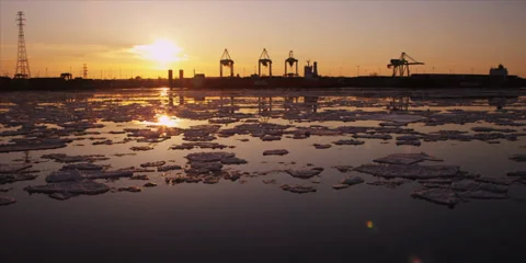 Time lapse of cranes unload ship at commercial port during iceberg sunset 8 Stock-Footage 37661077