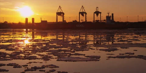 Time lapse of cranes unload ship at commercial port during iceberg sunset 6 Stock-Footage 37661107