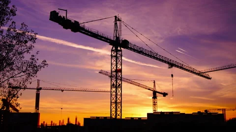 Time lapse  cranes working in construction site at dusk, tilt stock footage Stock Footage 55431191
