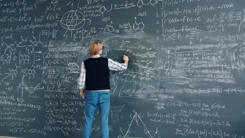 Time lapse of creative guy researcher writing formulas on chalkboard in class Stock Footage 125077416