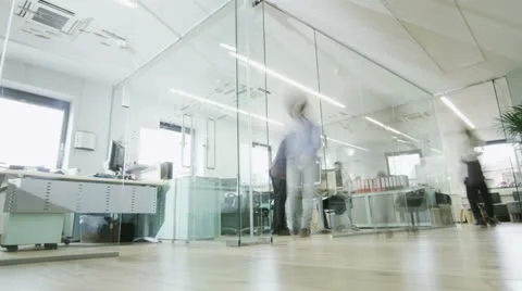 Time lapse of creative young professionals at work in busy modern office Stock Footage