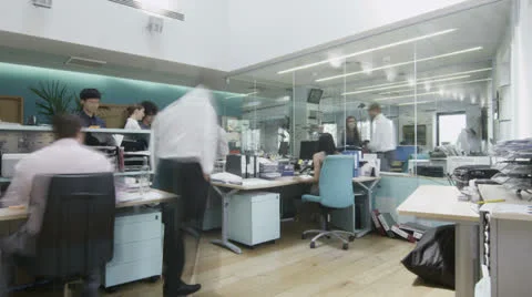Time lapse of creative young professionals at work in busy modern office Stock Footage 25856413