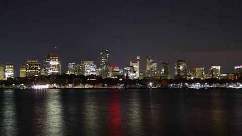 Time-Lapse of the Crescent Moon Rising over the Boston Skyline Stock Footage