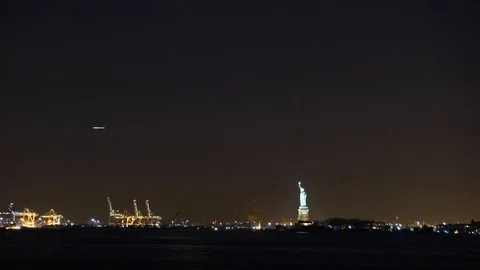 Time-lapse of the crescent moon setting over the Statue of Liberty Stock Footage 90263539