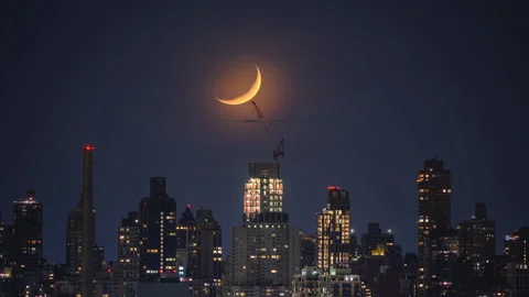 Time lapse of crescent moon setting over New York City Stock Footage 308257951