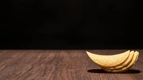Time lapse. Crispy potato chips. Appear and compactly fold lengthwise. Stock Footage 107006481