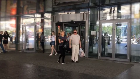 Time-lapse crowd people enter and leave the store of a large supermarket Stock Footage 89460132
