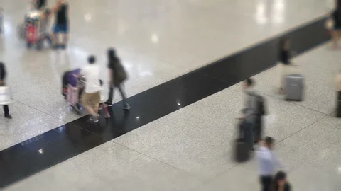Time lapse of crowd of unrecognizable people walking with luggage Stock Footage 91248906