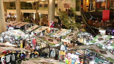 Time lapse of crowd walking and buying goods in the market Stock Footage 144136724