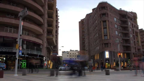 Time lapse crowd of walking people similar ghosts on background buildings with Stock Footage 101581047
