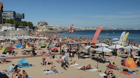 Time lapse of crowded sandy beach in Cascais near Lisbon, Portugal Stock Footage 93622012