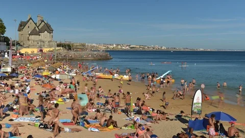 Time lapse of crowded sandy beach in Cascais near Lisbon, Portugal Stock Footage 93622084