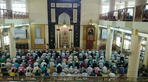 Time lapse of crowds of muslim men listening to the khutbah or preaching Stock Footage 41677369